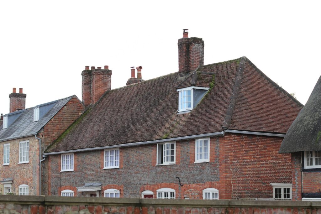 Row of traditional brick houses with tiled roofs, the kind of brickwork discussed here