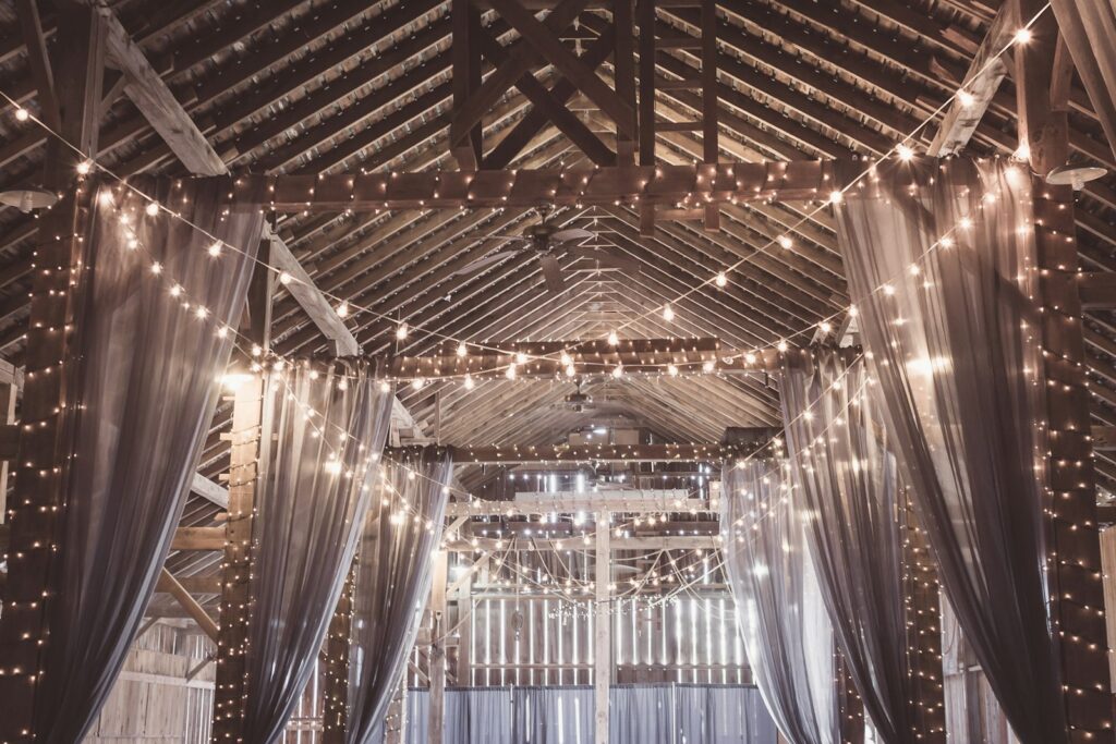String lights in a gazebo at an old barn used for a rustic wedding